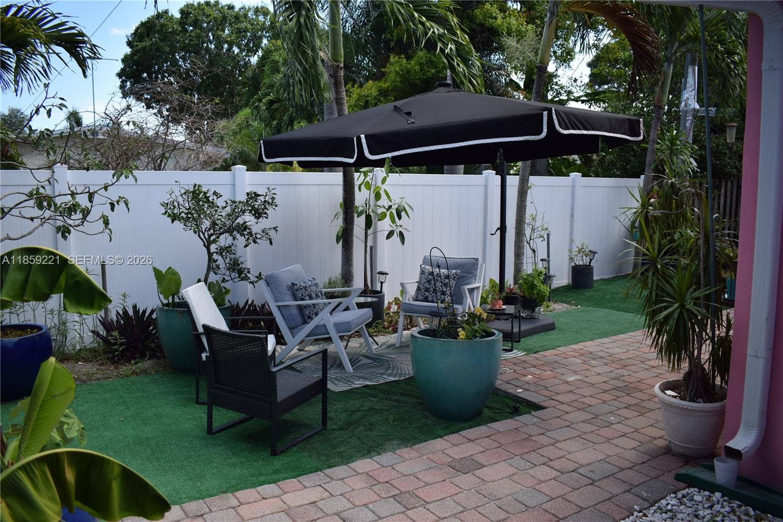 524 NE 27th Drive, Wilton Manors, FL 33334 Spacious backyard layout allows for a variety of cozy outdoor settings, ideal for relaxation and gatherings
