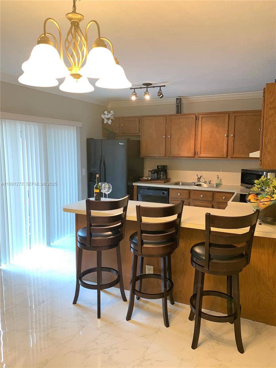 2561 Camelot Court, Cooper City, Cooper City, FL 33026 Kitchen with Island Bar
