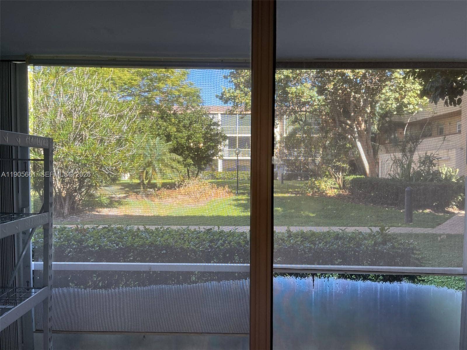 Screened Patio with Accordion Hurricane Shutters