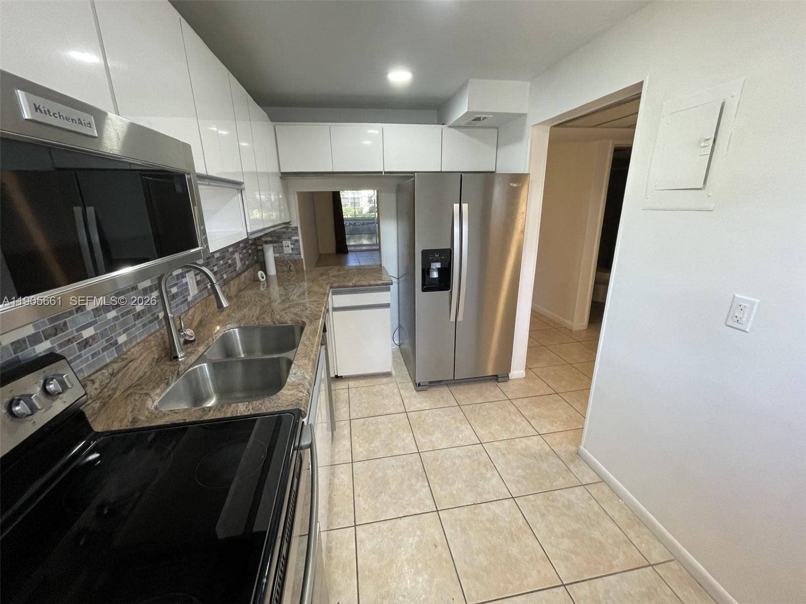 Kitchen with New Stainless Steel Appliances and Recessed Ceiling Lights