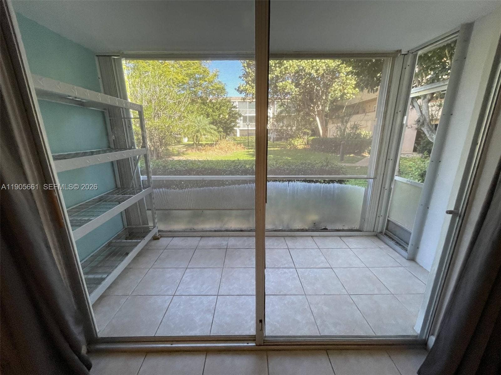 Screened Patio with Accordion Hurricane Shutters