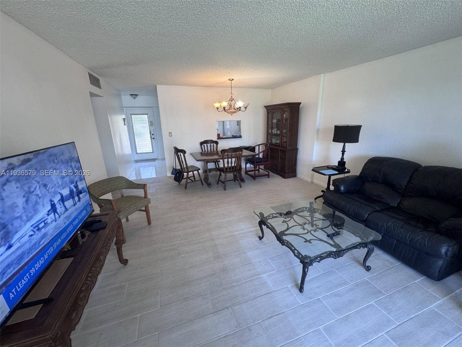 1025 SE 3rd Avenue, #102, Dania Beach, FL 33004 Living room facing front door