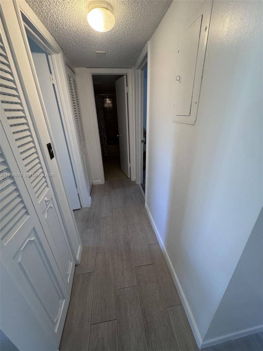 1025 SE 3rd Avenue, #102, Dania Beach, FL 33004 Hallway to guest bath and bedrooms