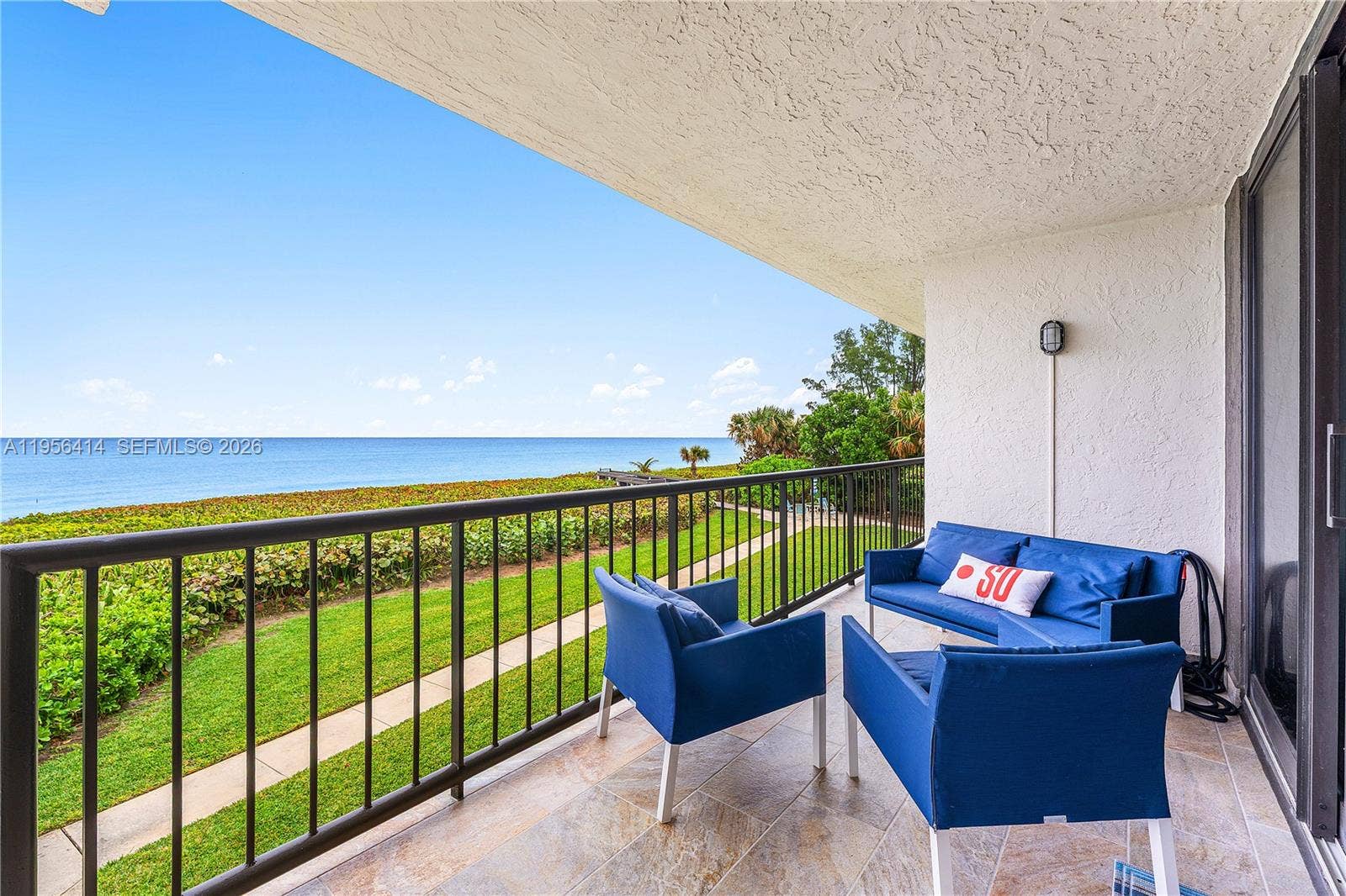 Balcony from living room and Primary BR overlooks ocean