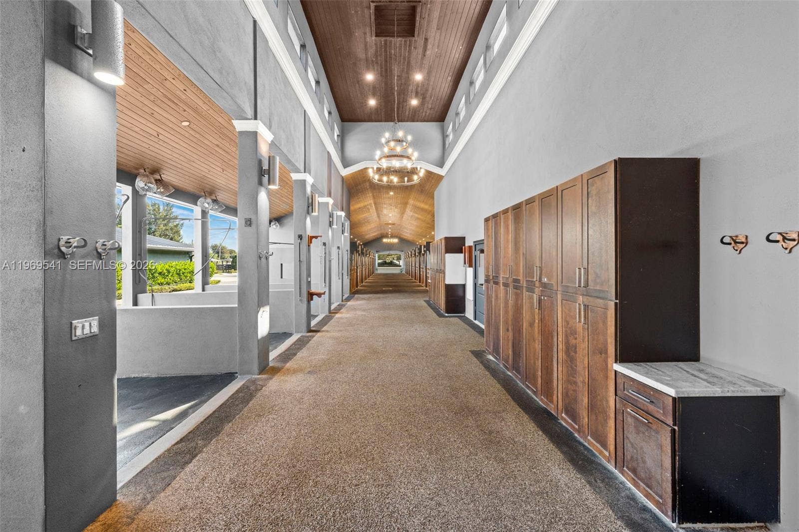 2625 SW 148th Avenue, Davie, FL 33331 Barn hallway with high tongue & groove ceilings and lockers for supplies.
