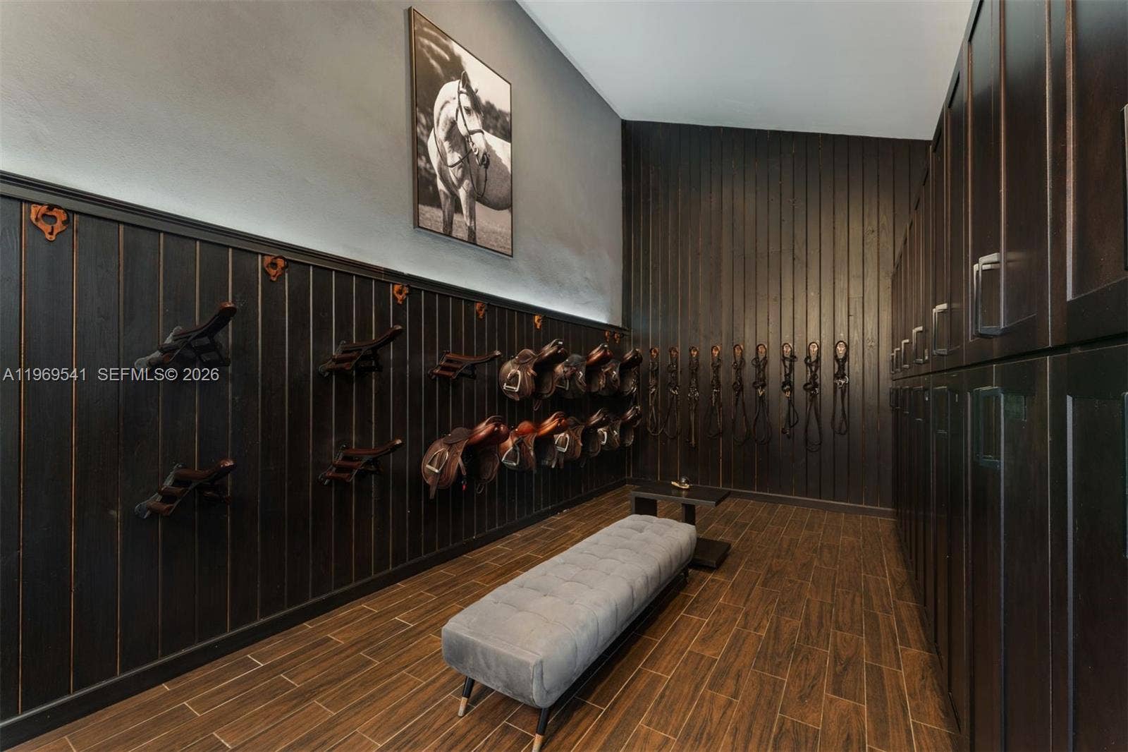 2625 SW 148th Avenue, Davie, FL 33331 Tack room with high ceilings, sink, and lockers.