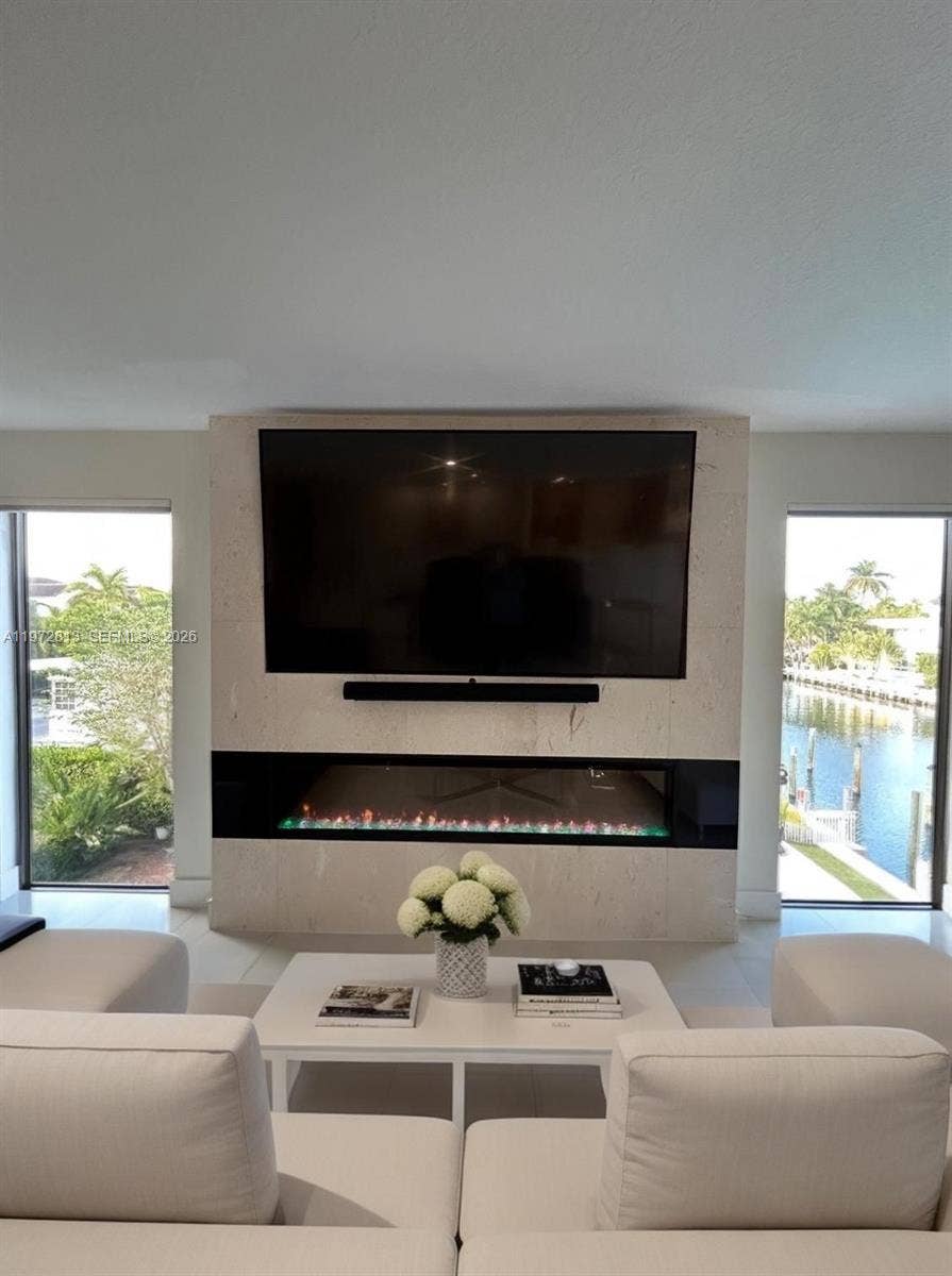 76 Isle Of Venice Drive, #H, Fort Lauderdale, FL 33301 Hug LR w/fireplace & water views