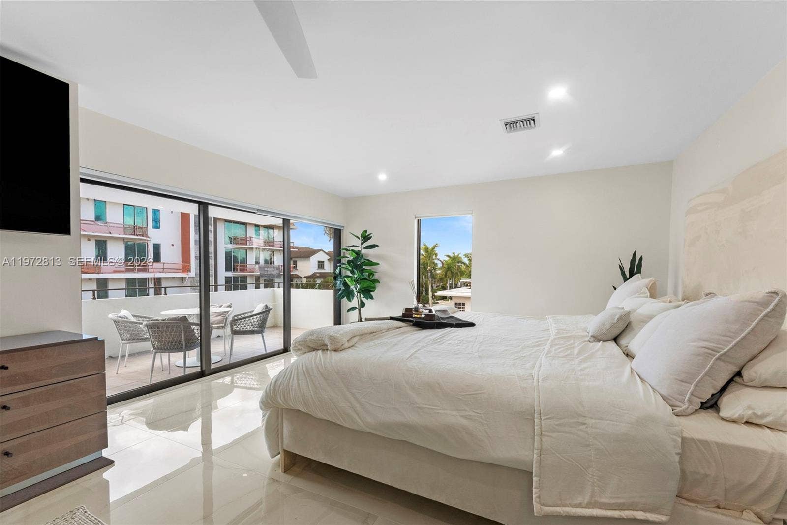 76 Isle Of Venice Drive, #H, Fort Lauderdale, FL 33301 Primary Suite leads to outdoor patio