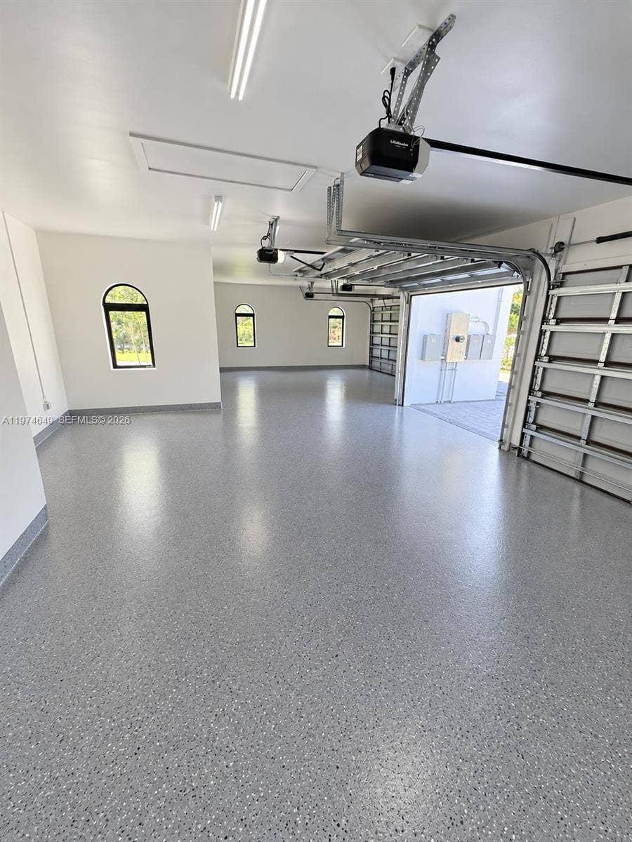 Garage will have epoxy floor. AI Staged.