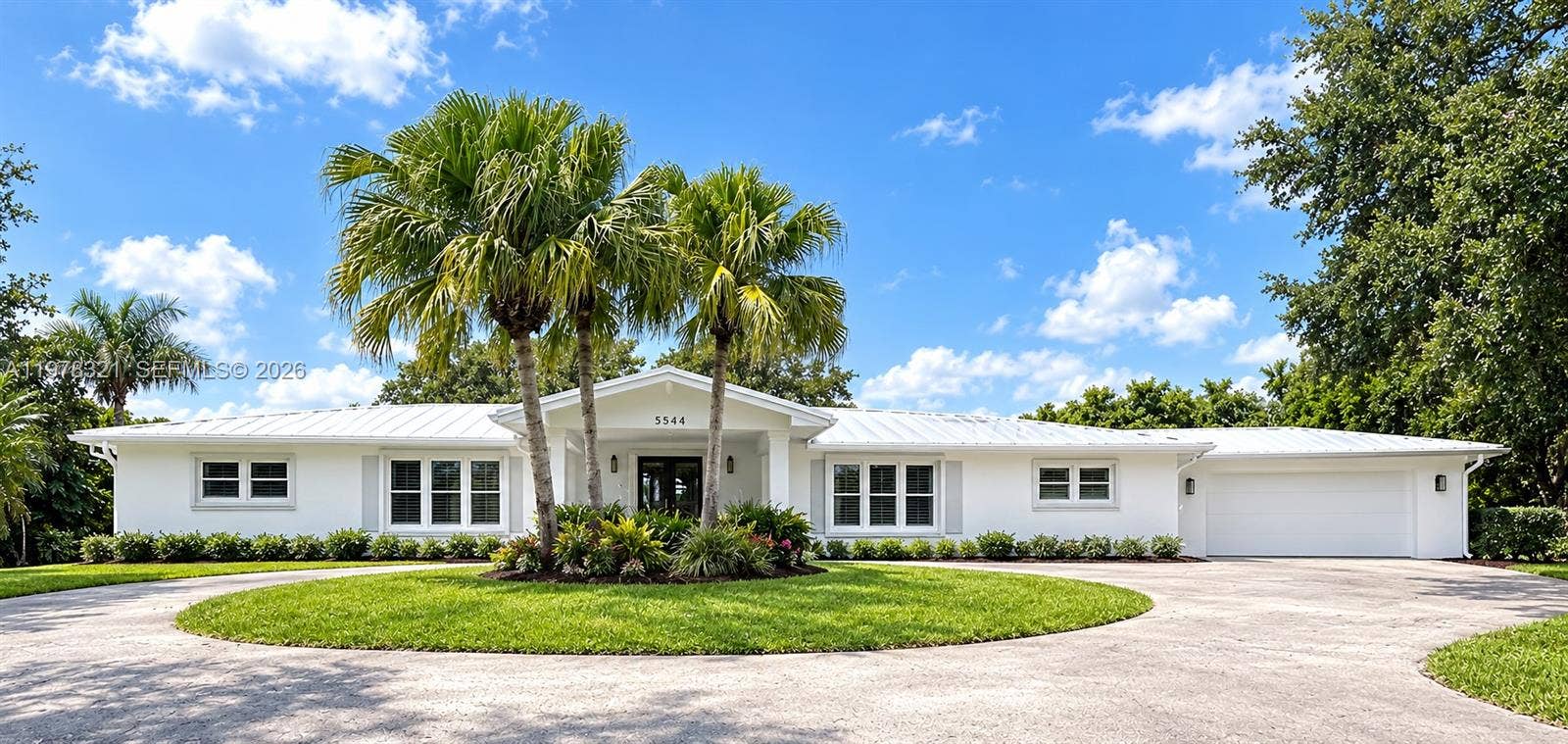 House Repainted to White with light Grey trim & garage