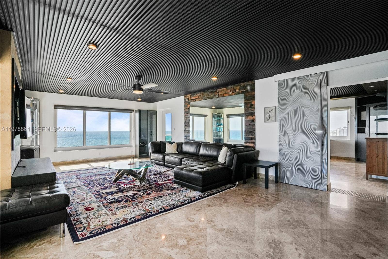 Living Room with view into Primary Bedroom