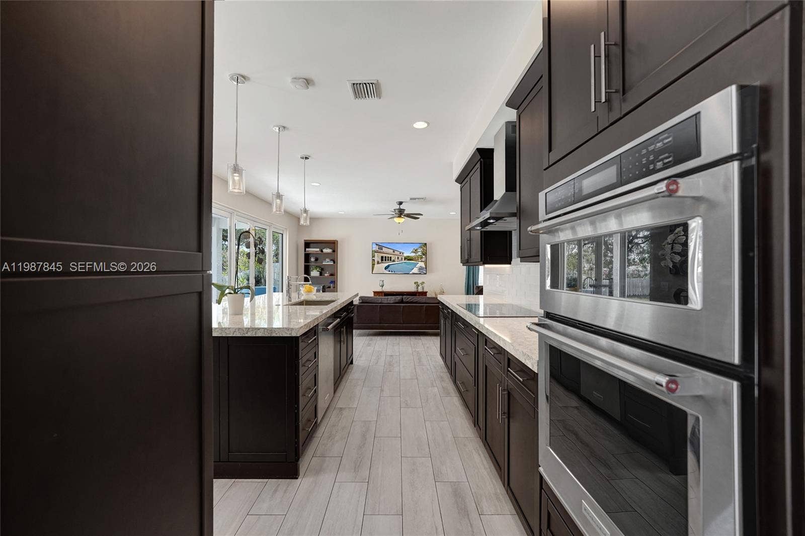 484 Cambridge Drive, Weston, FL 33326 Walking into the kitchen from the Dining Room