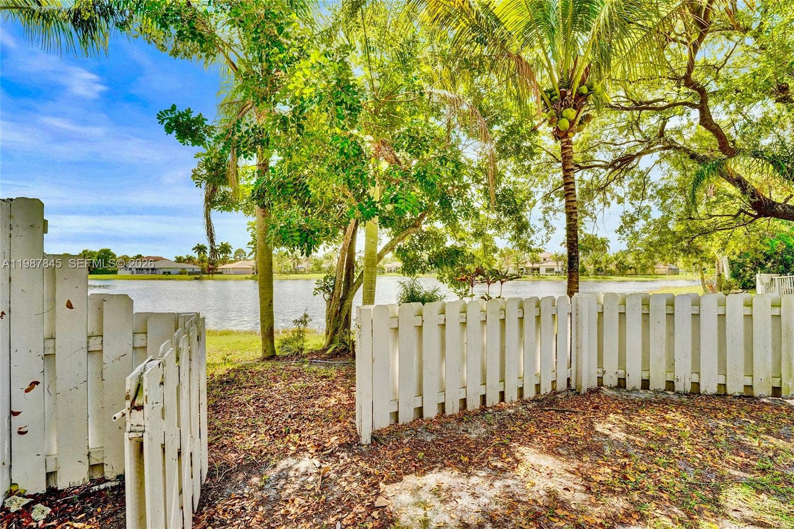 484 Cambridge Drive, Weston, FL 33326 Gated opening leading to lake in backyard