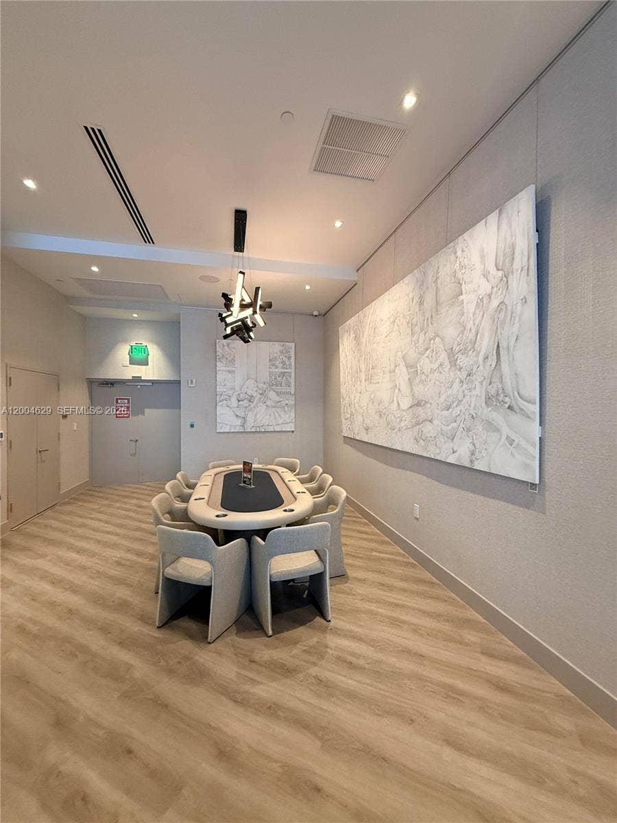 333 Las Olas Way, #304, Fort Lauderdale, FL 33301 Enjoy dedicated gaming in the elegant card room, featuring custom furnishings and a sophisticated ambiance, perfect for hosting friends or enjoying a quiet game night.