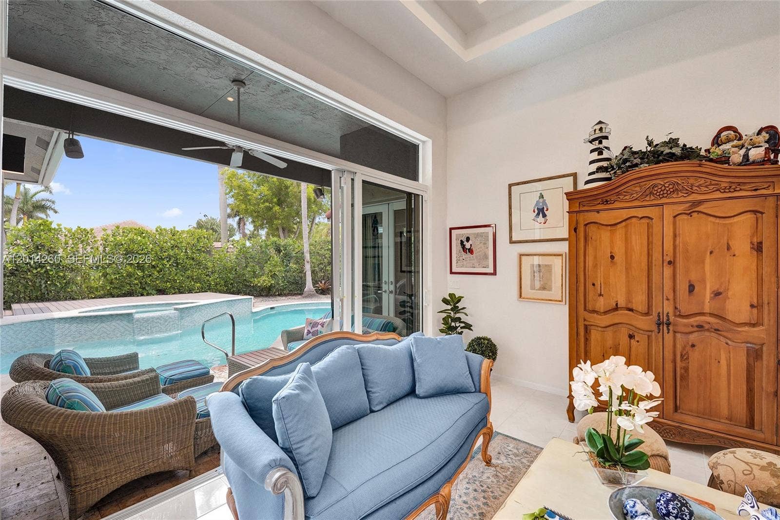 1640 Island Way, Weston, FL 33326 Living room opens up to backyard & pool area. Impact doors slide into each other.