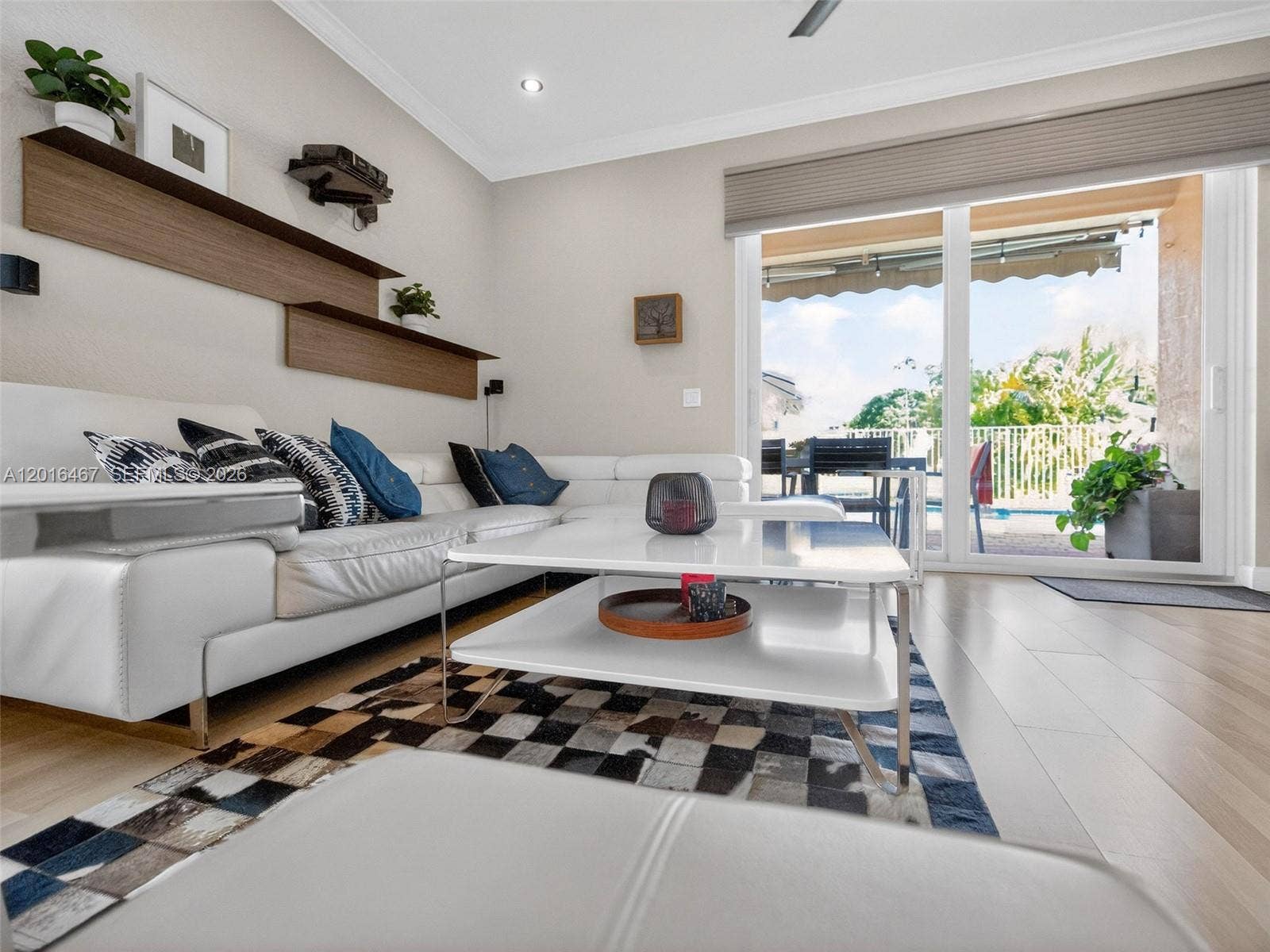 Bright and airy family room, with gorgeous views to the pool and lake.