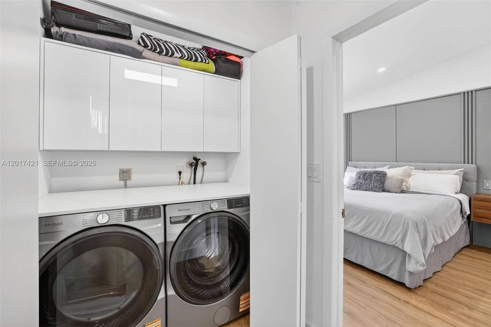 3848 Atlanta Street, Hollywood, FL 33021 Laundry next to primary bedroom w/ folding counter and extra storage