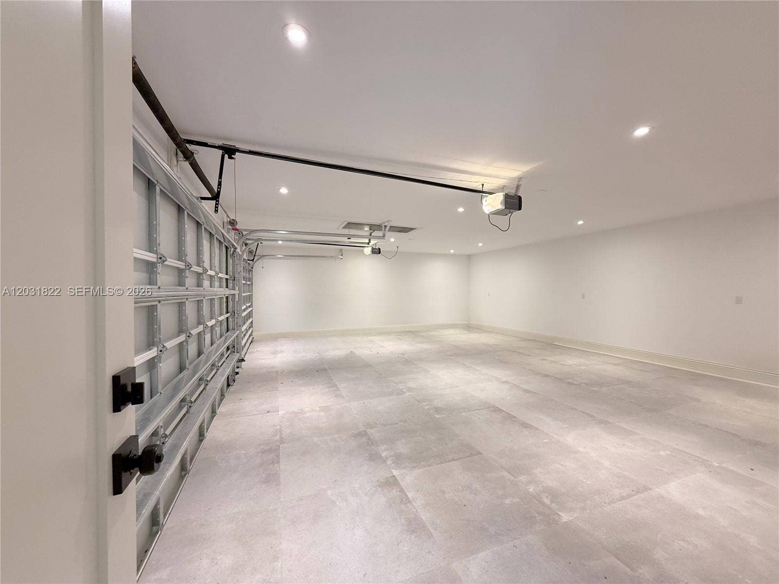 3 CAR GARAGE WITH TILE