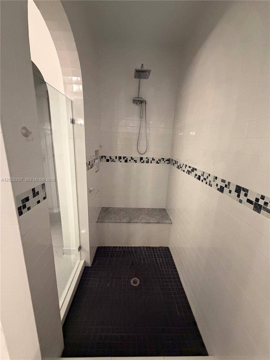 WALK IN SHOWER WITH CUSTOM BENCH.