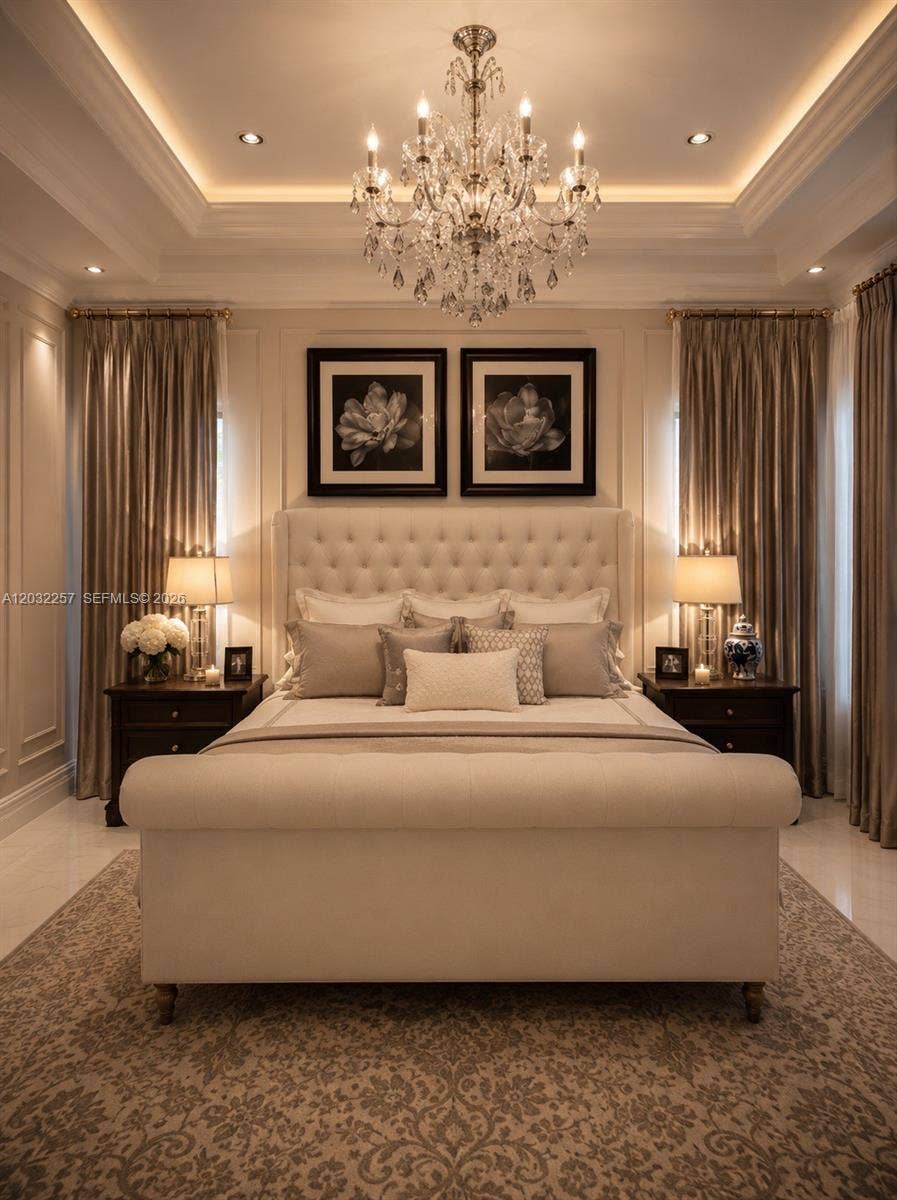 PRIMARY BEDROOM LOCATED ON THE FIRST FLOOR HAS ELEGANT DOUBLE TRAY CEILINGS DECORATED WITH A DESIGNER CHANDELIER. CUSTOM DRAPES AND SHADES WITH LUXURY HARDWARE SURROUND THIS BEAUTIFUL ROOM.