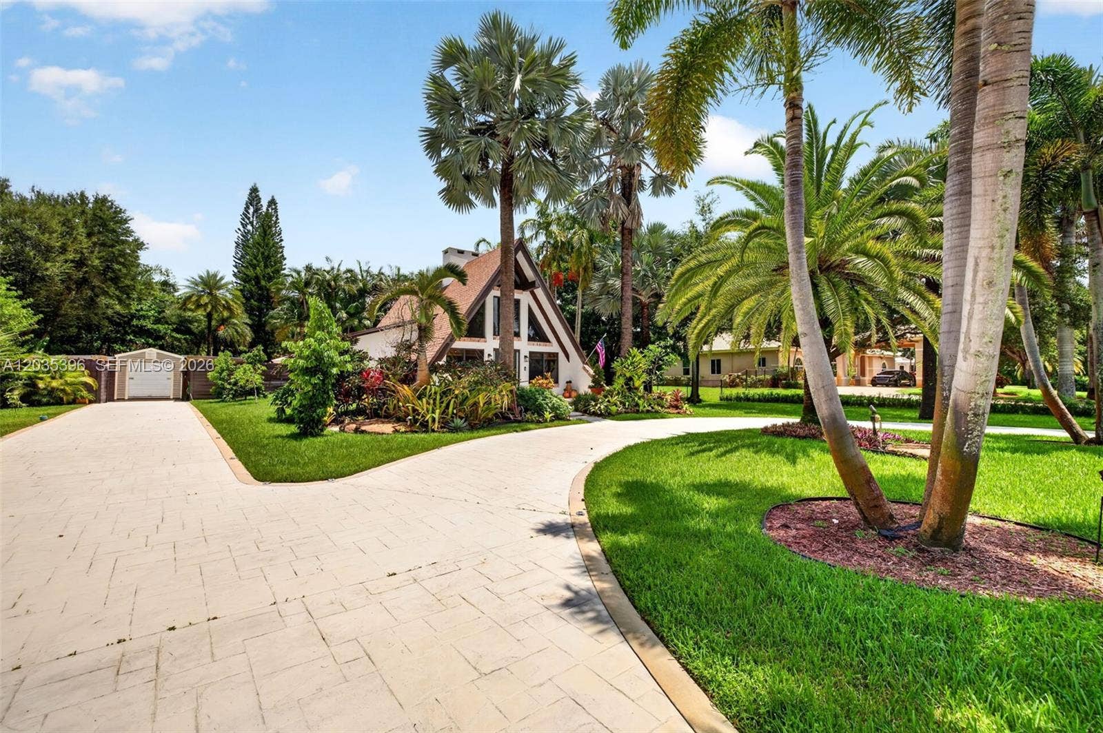Beautiful resurfaced driveway, plenty of parking for at least 8 vehicles on main house side, plus parking for several more cars on guest house side