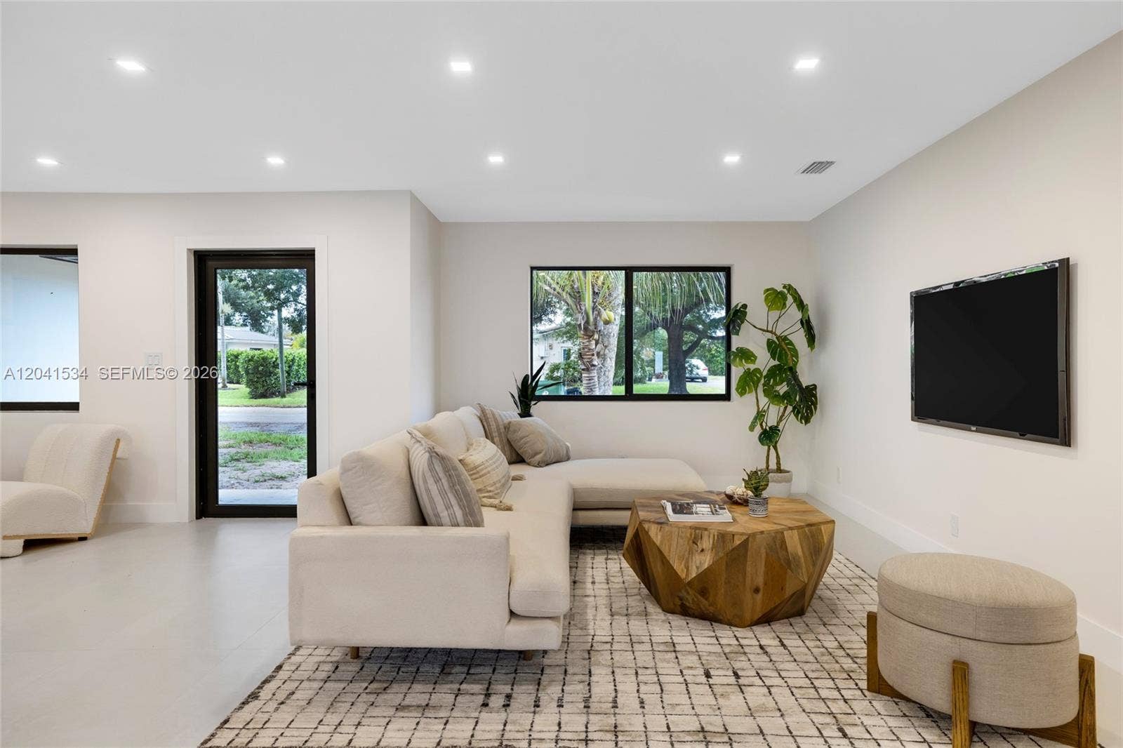 Open living room with contemporary finishes and natural light.