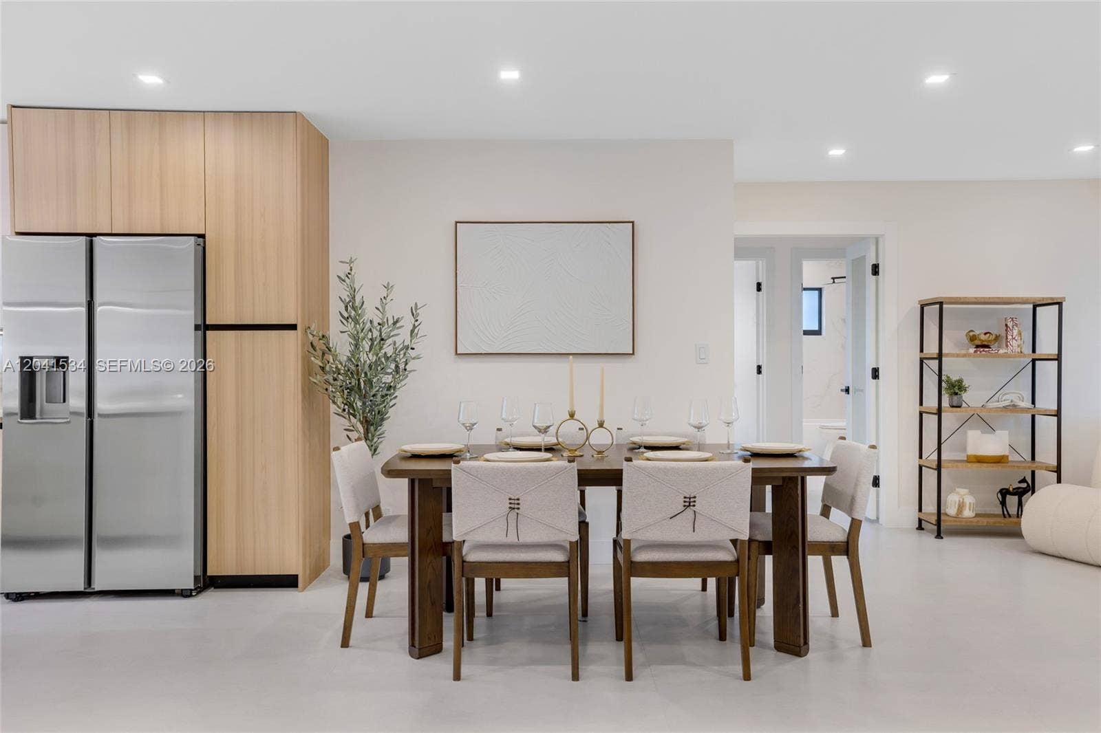 Dining area with contemporary finishes and open connection to the kitchen.