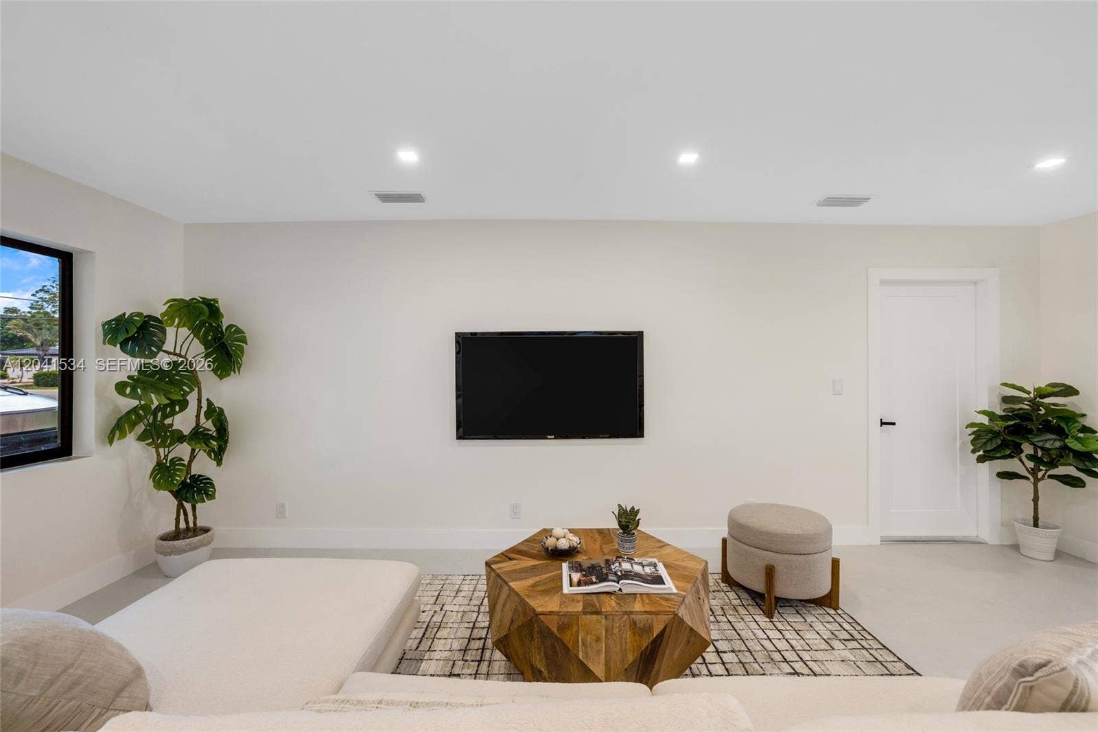 Reimagined living space with clean architectural lines and recessed lighting.