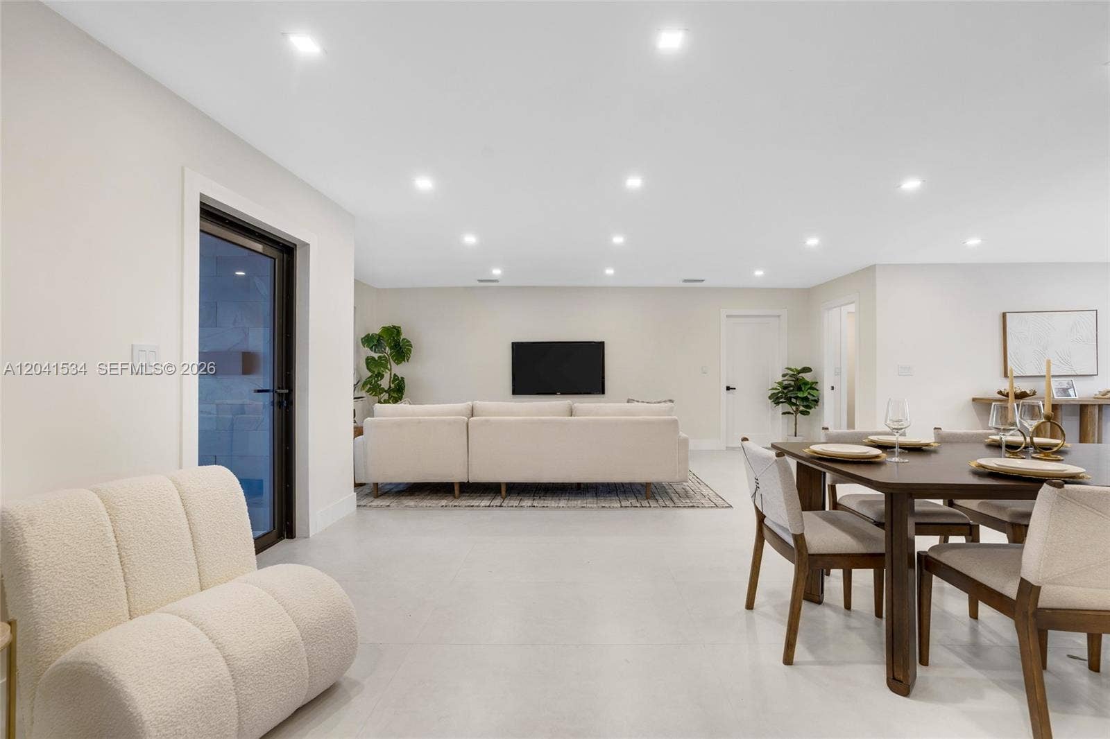 Open dining area within the renovated Coral Ridge Isles residence.
