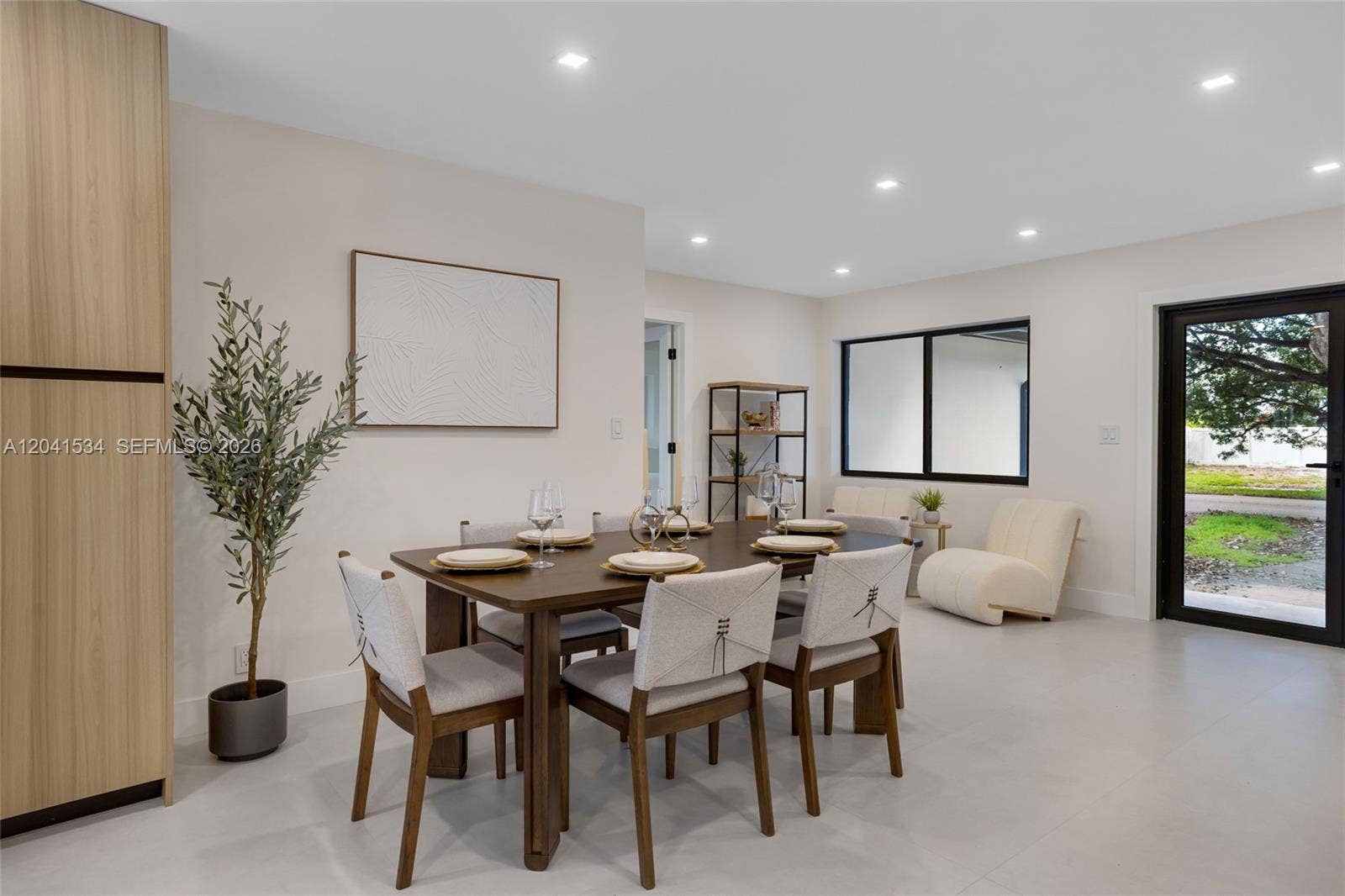 Dining area with natural light and contemporary interior design.
