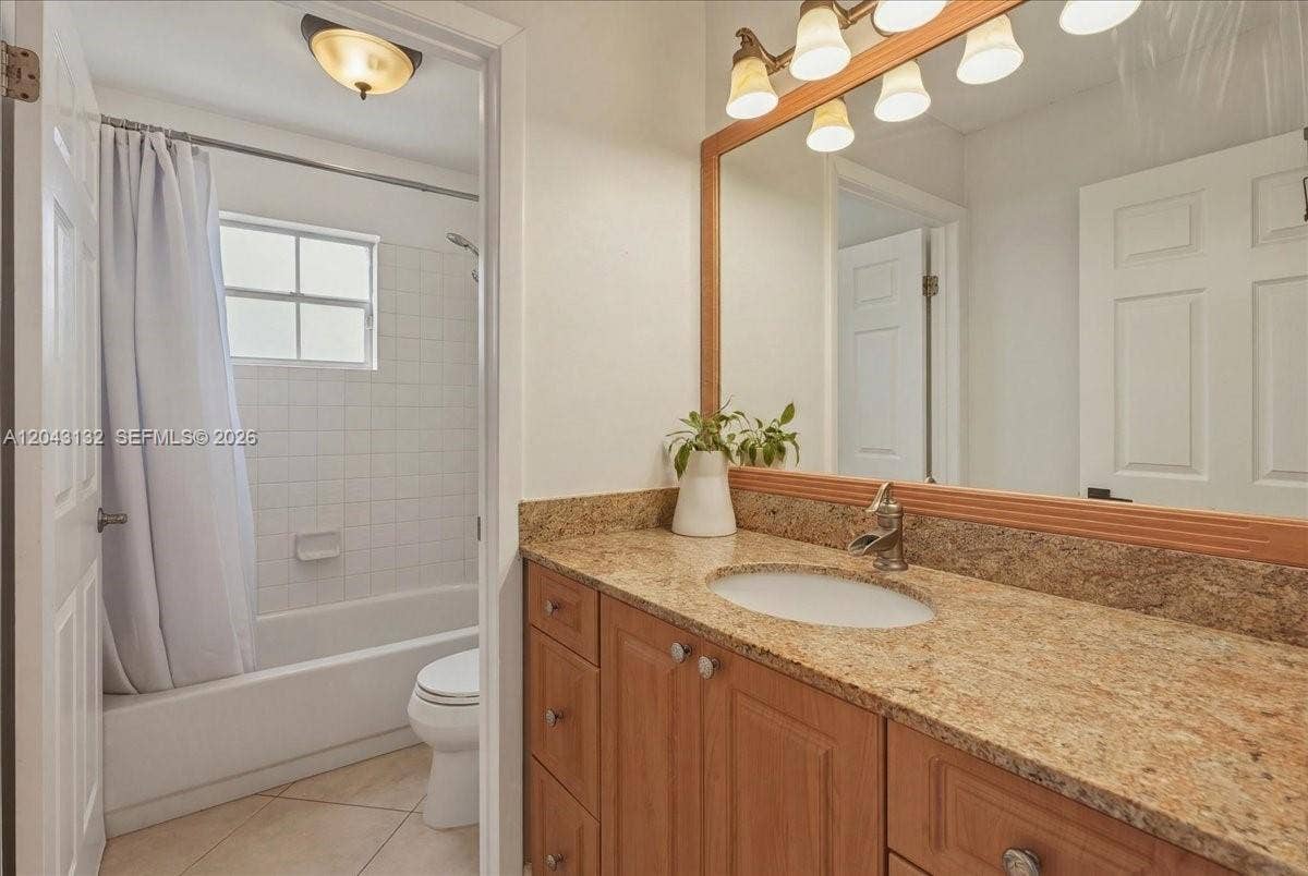 Second bathroom with a door giving privacy when you take a shower.