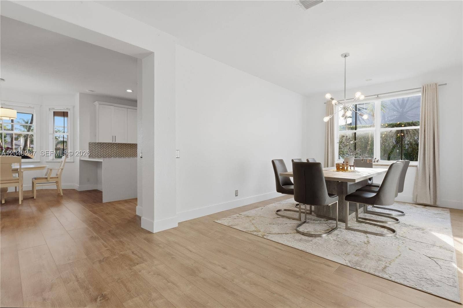 Formal Dining Area with a glimpse of the kitchen.