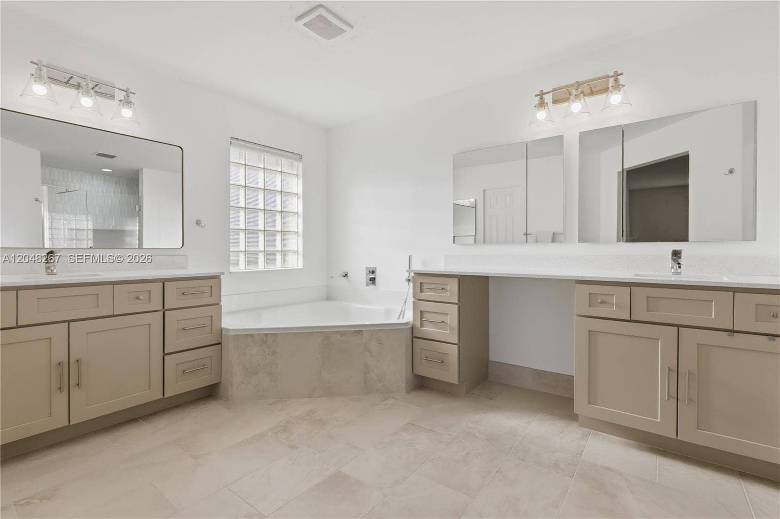 Main Bathroom with separate sinks.
