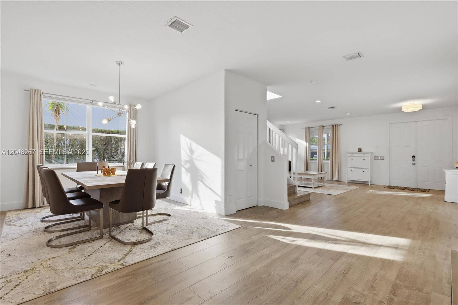 Dining Area and Living Room Area with under the stairs closet