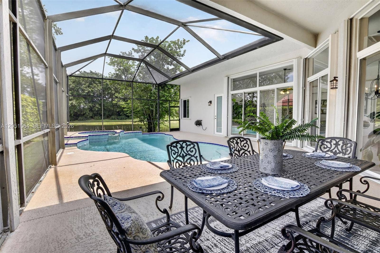 1164 Ginger Circle, Weston, FL 33326 Covered patio, lots of space for entertaining overlooking the lake
