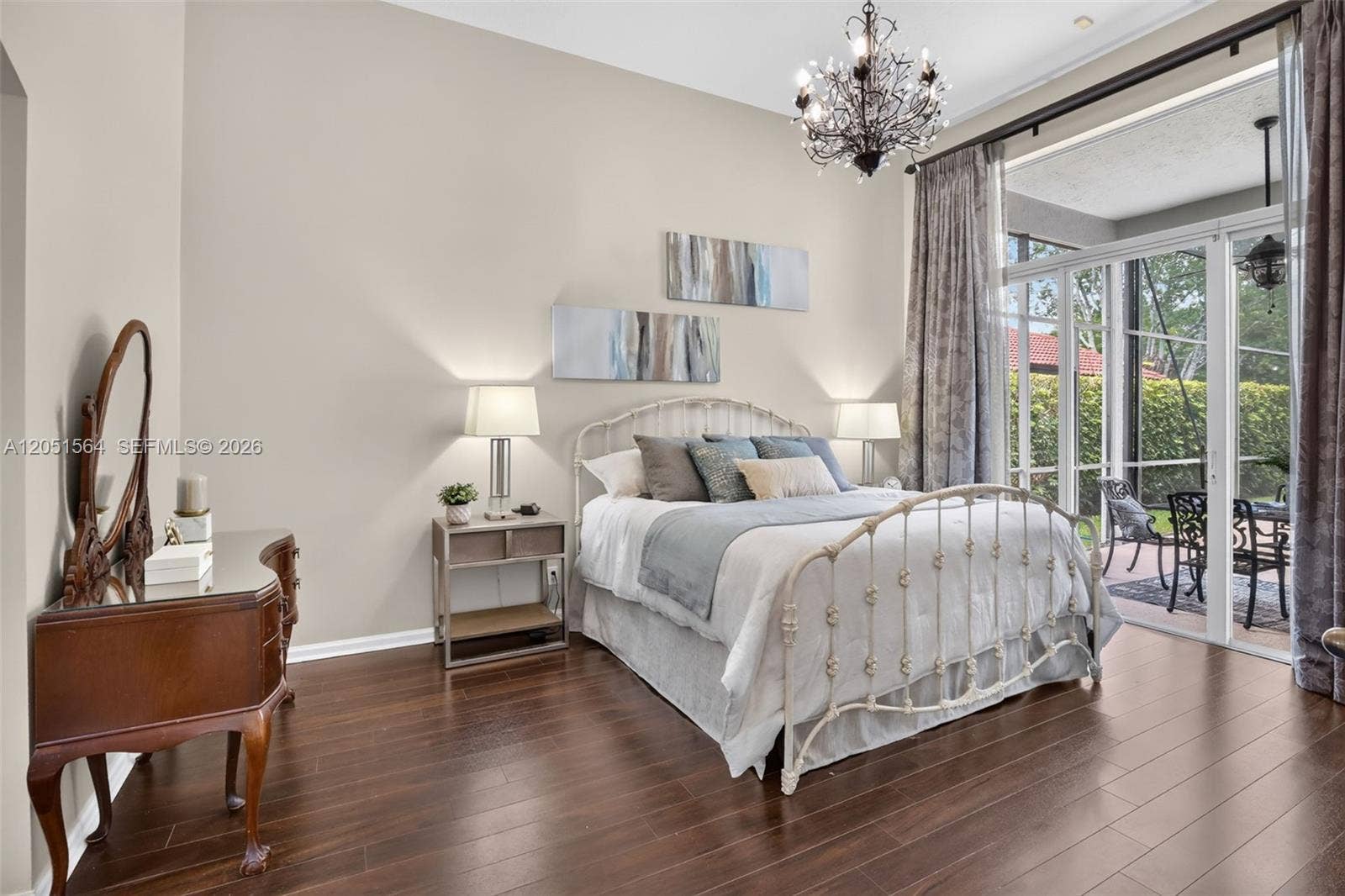 1164 Ginger Circle, Weston, FL 33326 Master bedroom overlooking the pool and lake.