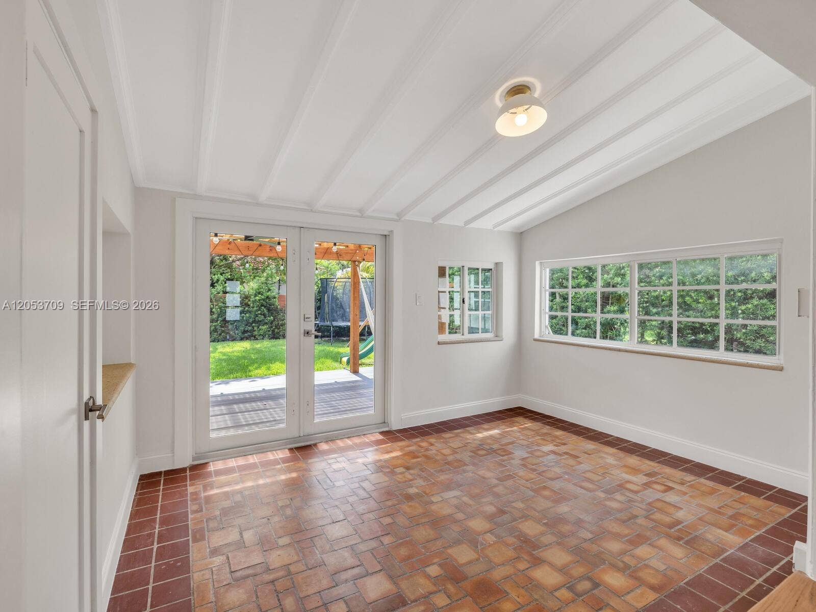 9033 Carlyle Avenue, Surfside, FL 33154 Sunny Florida Room
