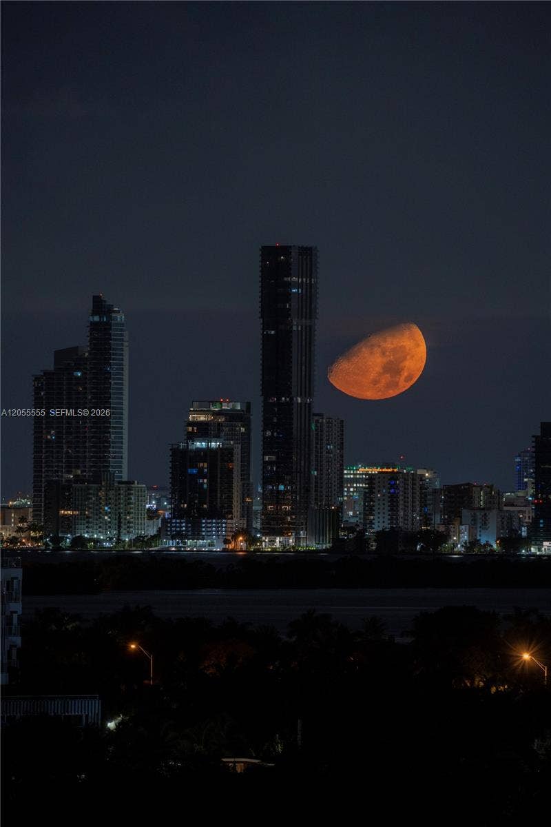 5151 Collins Avenue, #1420, Miami Beach, FL 33140 Moon setting behind Edgewater taken from unit balcony