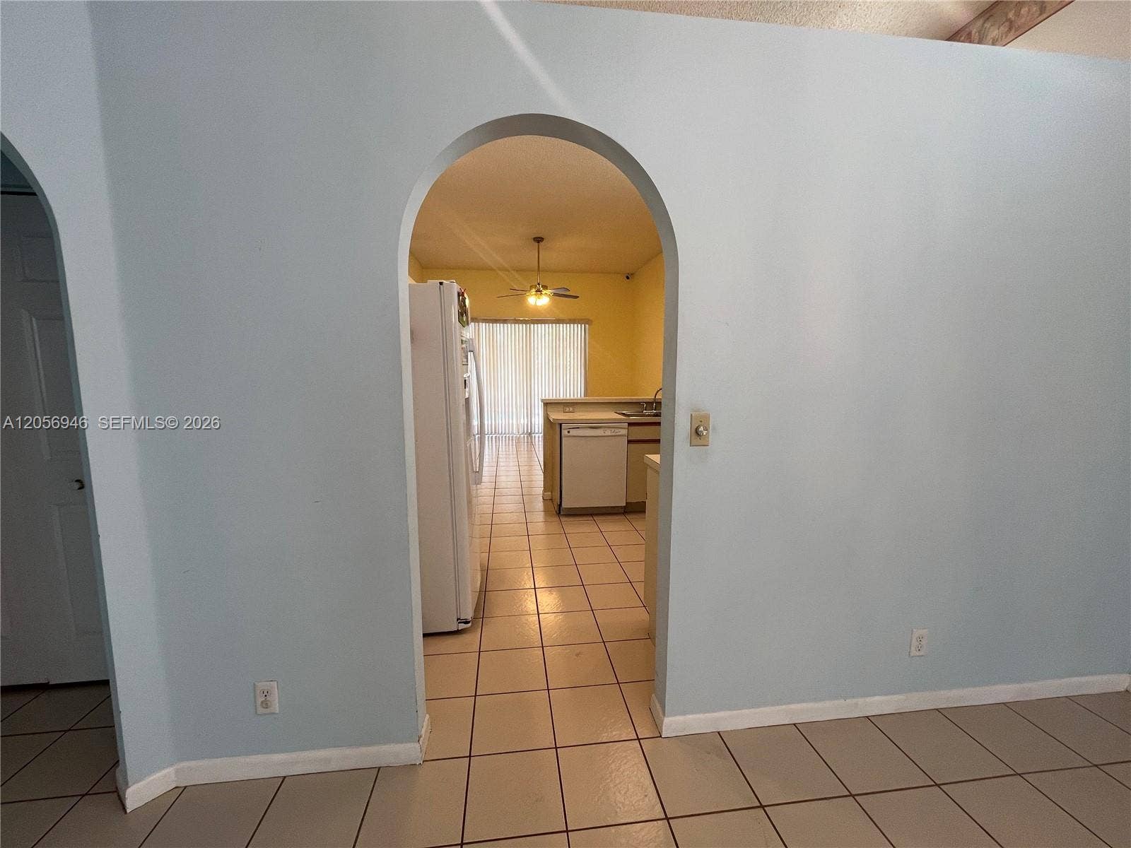 living room towards kitchen area - left towards 2-3 bedroom hallway