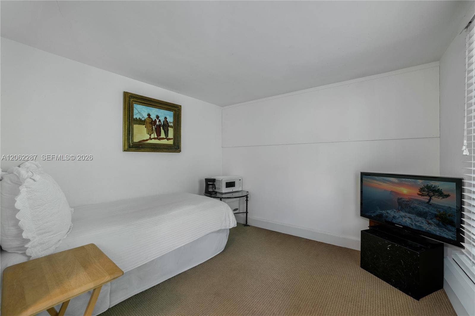 Staff Suite: Neutral-toned wall-to-wall carpeting and crisp white interior paint finish
