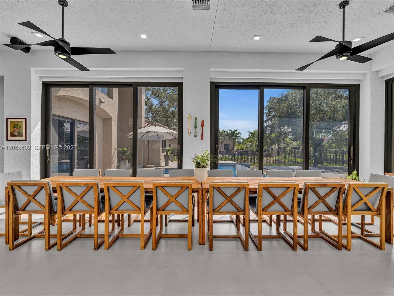 Indoor-outdoor Patio under AC with professional BBQ and room for extra large table, games etc.