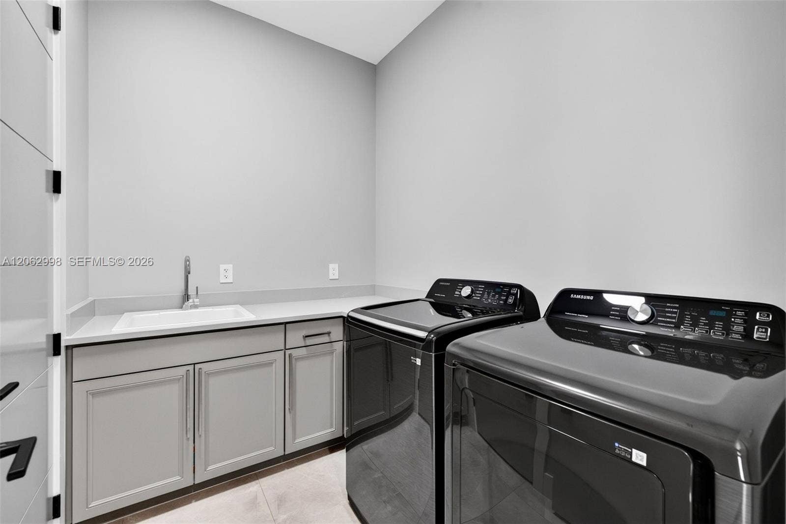 1004 SW 5th Place, Fort Lauderdale, FL 33312 Upstairs laundry room conveniently by the bedrooms w/ laundry tub