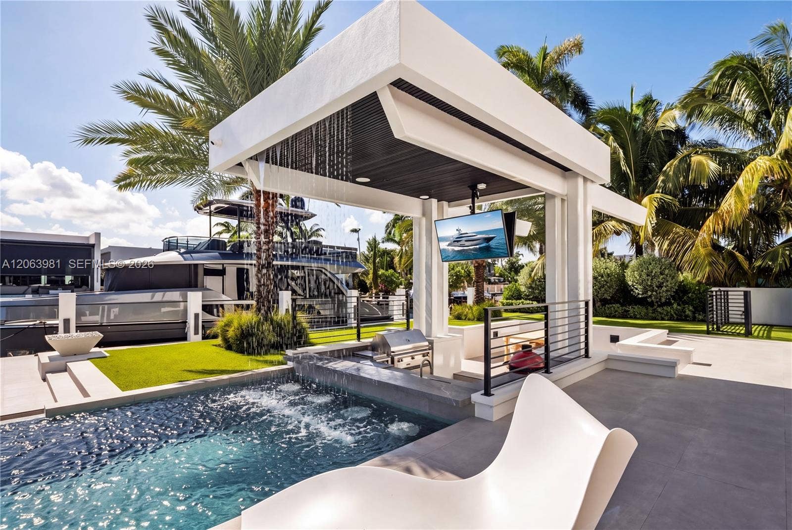 725 Poinciana Drive, Fort Lauderdale, FL 33301 Your own resort: a gazebo, a waterfall, and a swim-up bar.