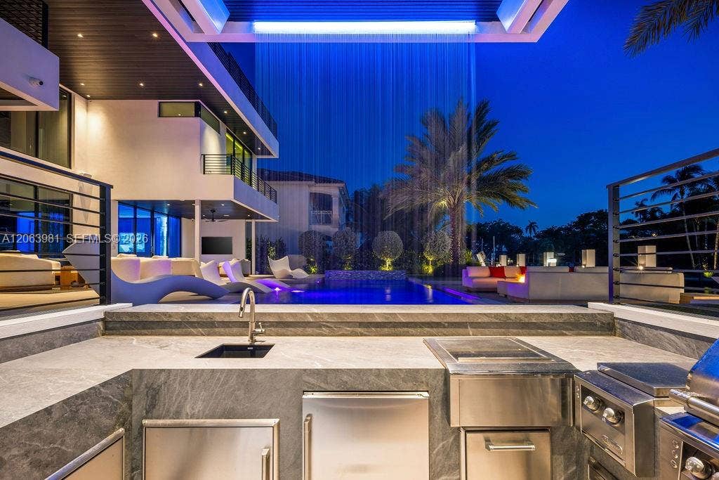 725 Poinciana Drive, Fort Lauderdale, FL 33301 Your own resort: a gazebo, a waterfall, and a swim-up bar.
