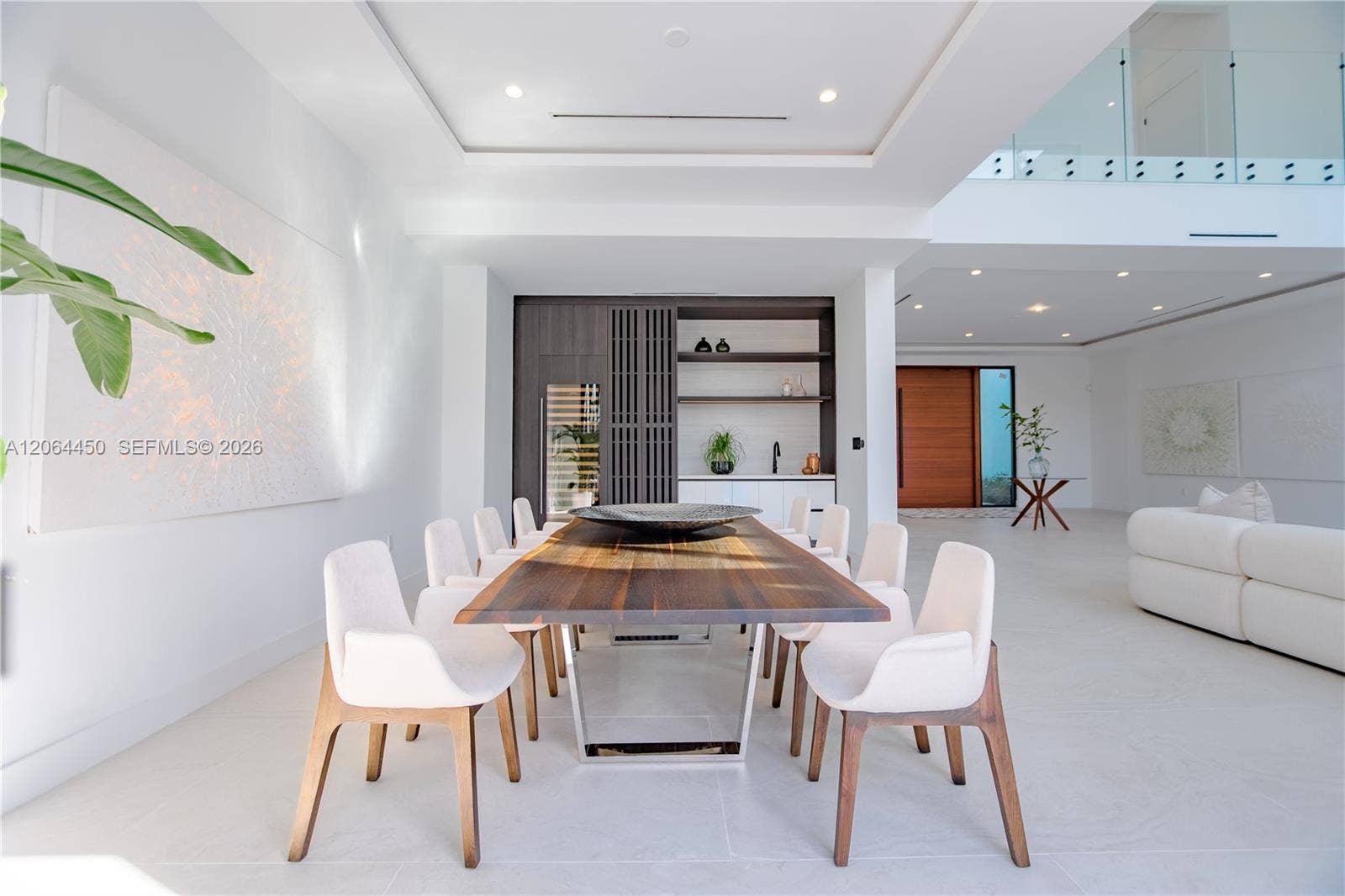 Dining area flowing into the living spaces with clean modern detailing