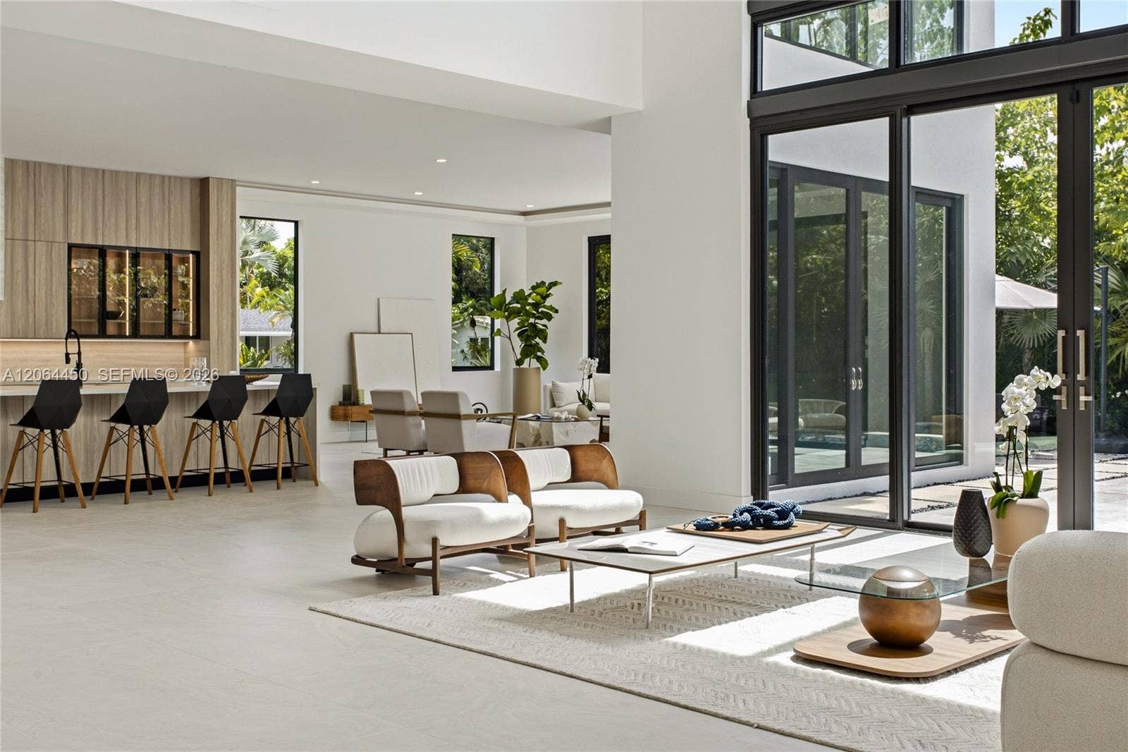 Open concept living and kitchen with contemporary finishes throughout