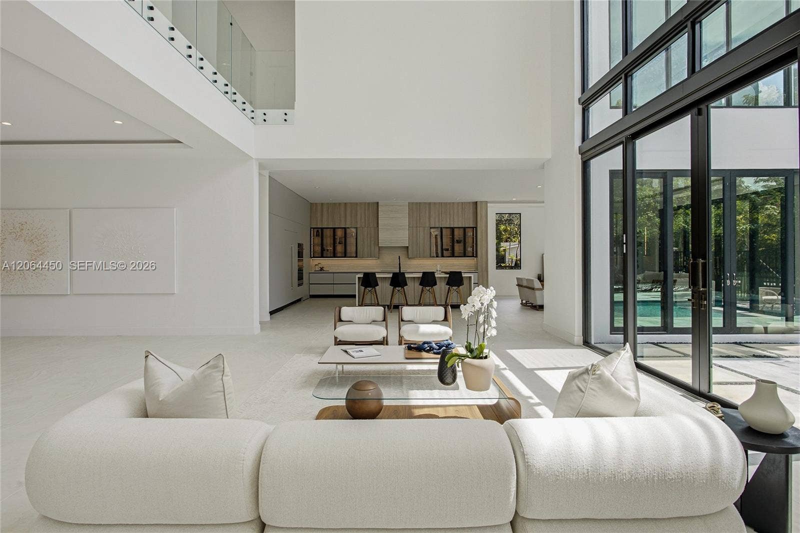 Bright, airy family living space with oversized windows and indoor outdoor connection
