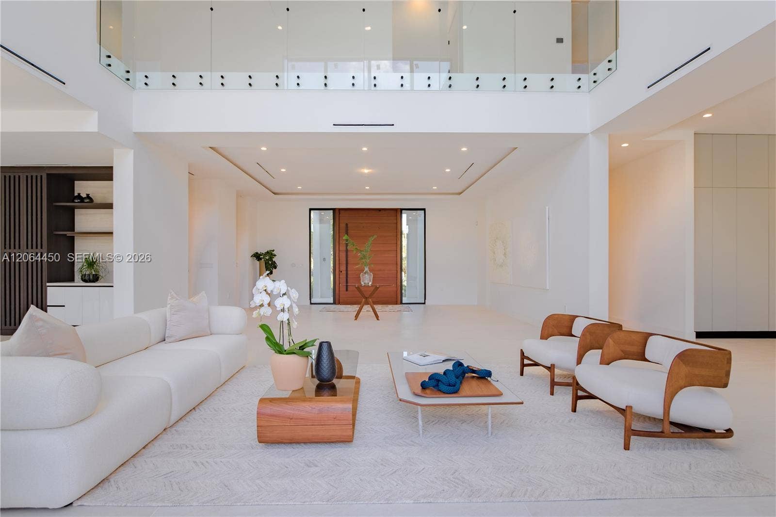Grand living room with a clerestory balcony and dramatic volume