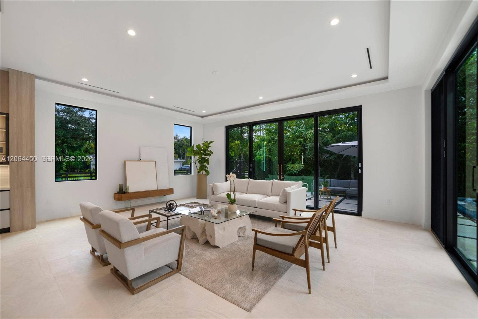 Primary suite lounge area with ample natural light and room to unwind