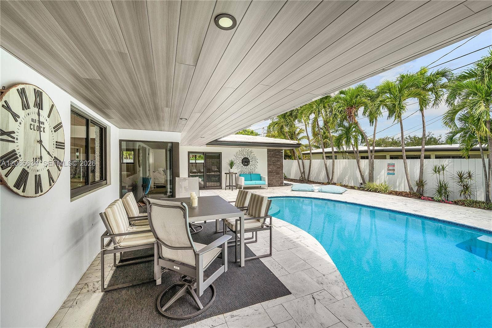 2153 Imperial Point Drive, Fort Lauderdale, FL 33308 WOOD PANEL OVERHANG OUT DOOR DINING AREA